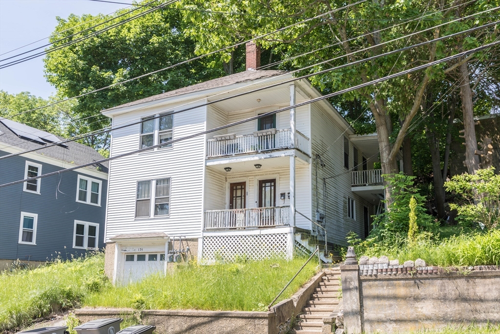 171 Sherman Street Gardner, MA 01440 - Photo 10 of 10 a front view of a house with garden