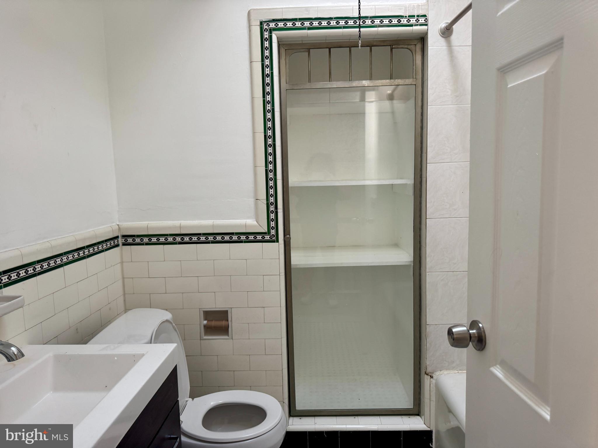 318 West Godfrey Avenue Philadelphia, PA 19120 - Photo 14 of 25 a bathroom with a toilet and a sink