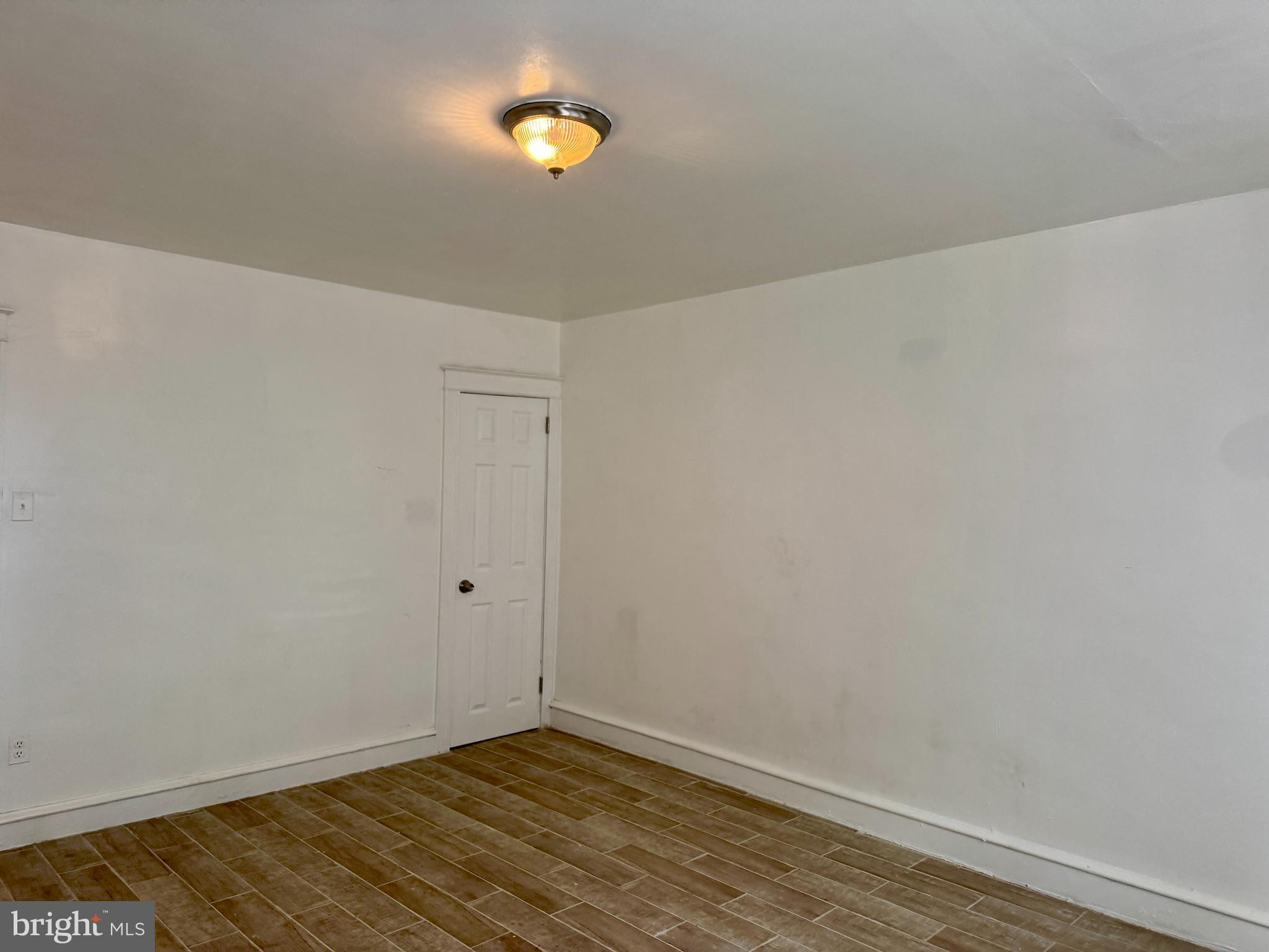 318 West Godfrey Avenue Philadelphia, PA 19120 - Photo 16 of 25 a view of an empty room with a window