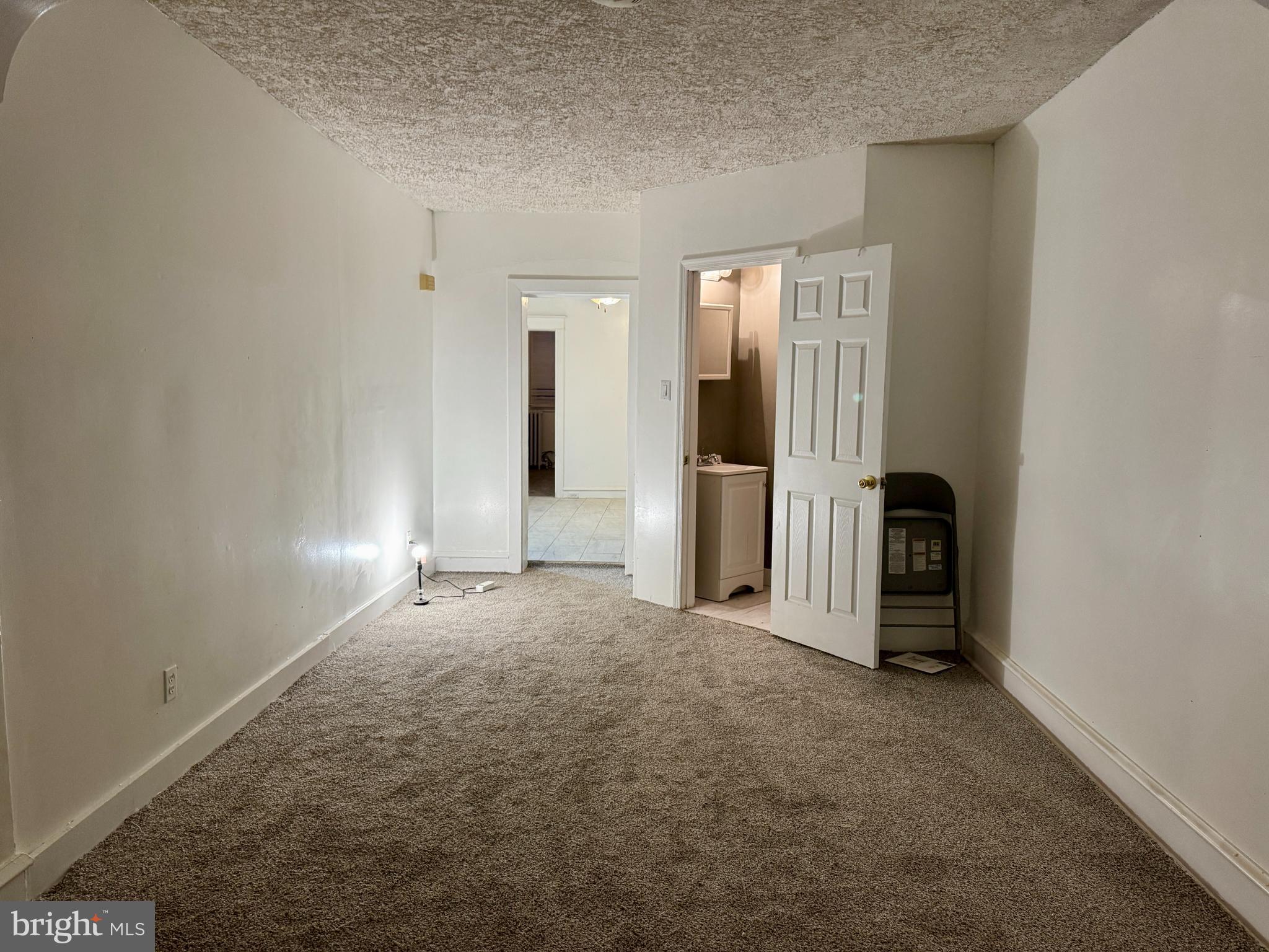 318 West Godfrey Avenue Philadelphia, PA 19120 - Photo 4 of 25 an empty room with closet and a window