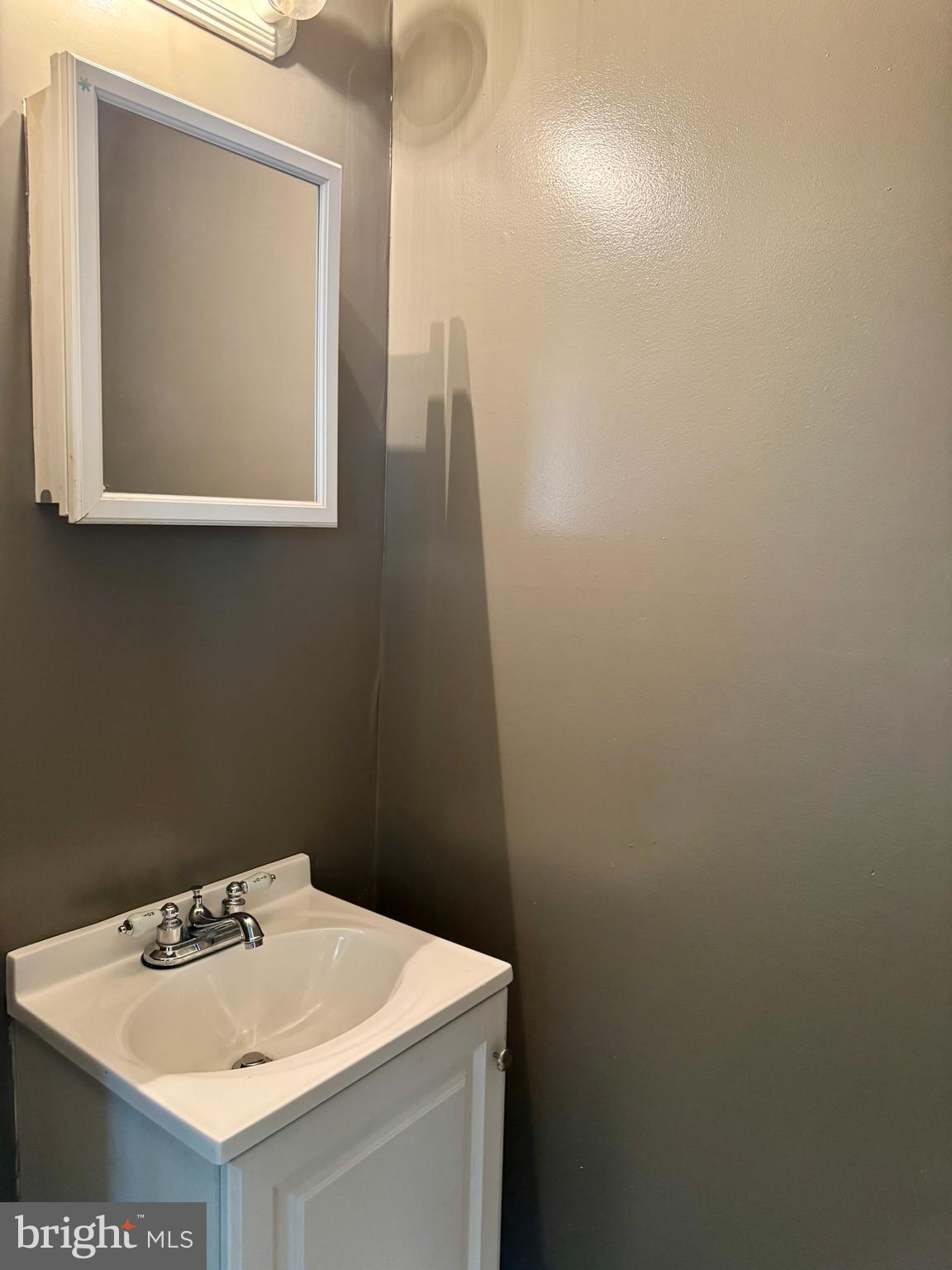 318 West Godfrey Avenue Philadelphia, PA 19120 - Photo 8 of 25 a bathroom with a sink vanity and a toilet