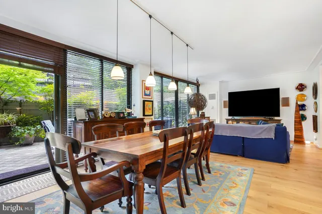 a view of a dining room with furniture window and wooden floor