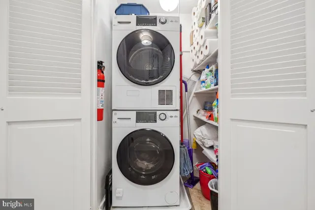 a bedroom with a bed a book shelf and a book shelf