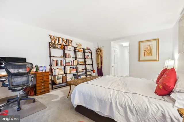 a spacious bathroom with a granite countertop sink mirror and toilet