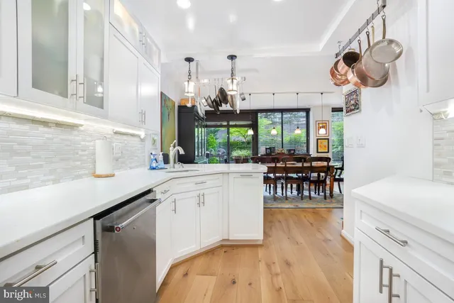 a kitchen with a sink cabinets and window