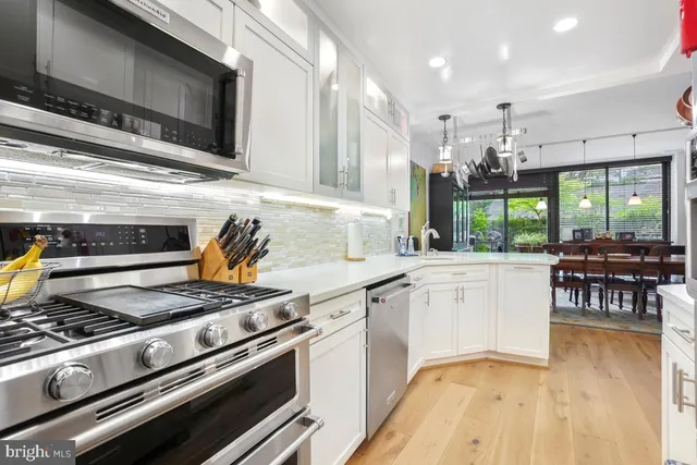 a kitchen with a stove and a microwave