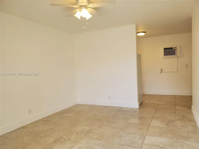 an empty room with a bathroom