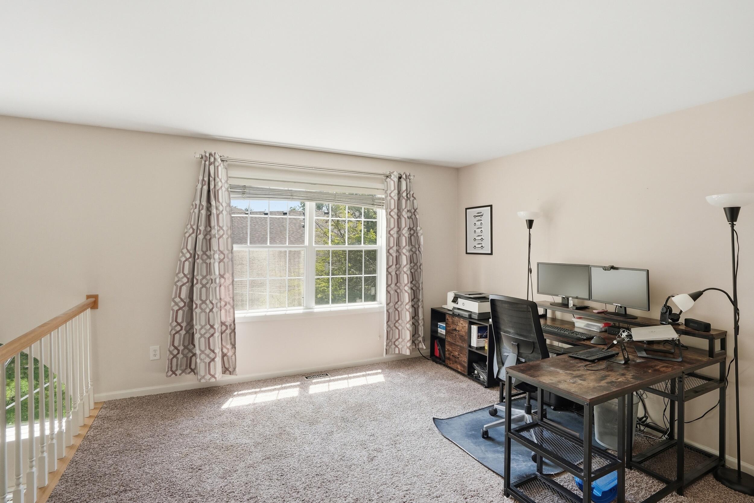 2184 Timberidge Lane Highland, IN 46322 - Photo 12 of 18 a view of a workspace with furniture and a window