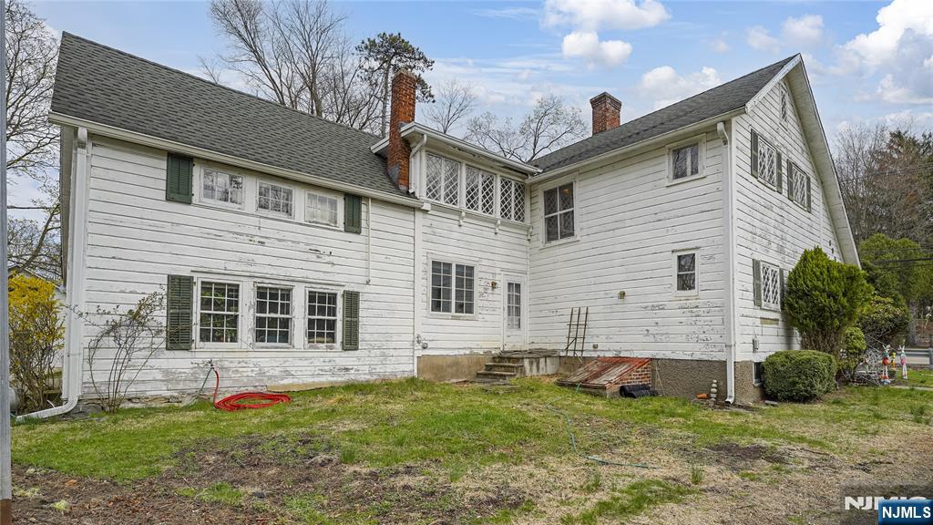 695 Ramapo Valley Road Oakland, NJ 07436 - Photo 8 of 42 a front view of a house with a yard
