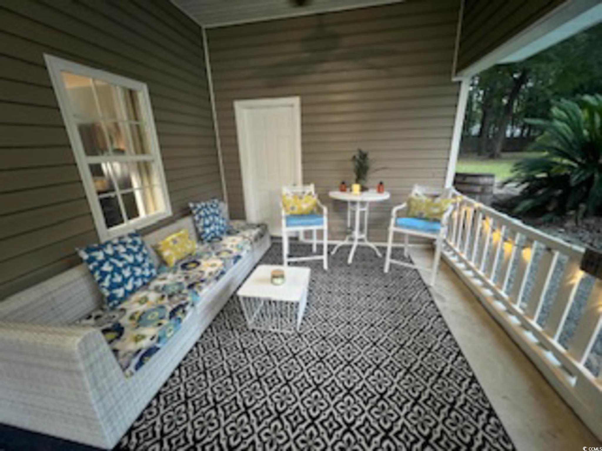 5588 Daybreak Road, Unit GUEST HOUSE Murrells Inlet, SC 29576 - Photo 1 of 18 Balcony with an outdoor hangout area