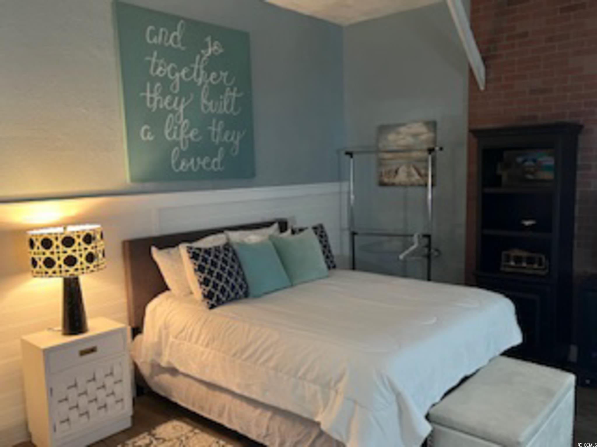 5588 Daybreak Road, Unit GUEST HOUSE Murrells Inlet, SC 29576 - Photo 11 of 18 Bedroom featuring brick wall