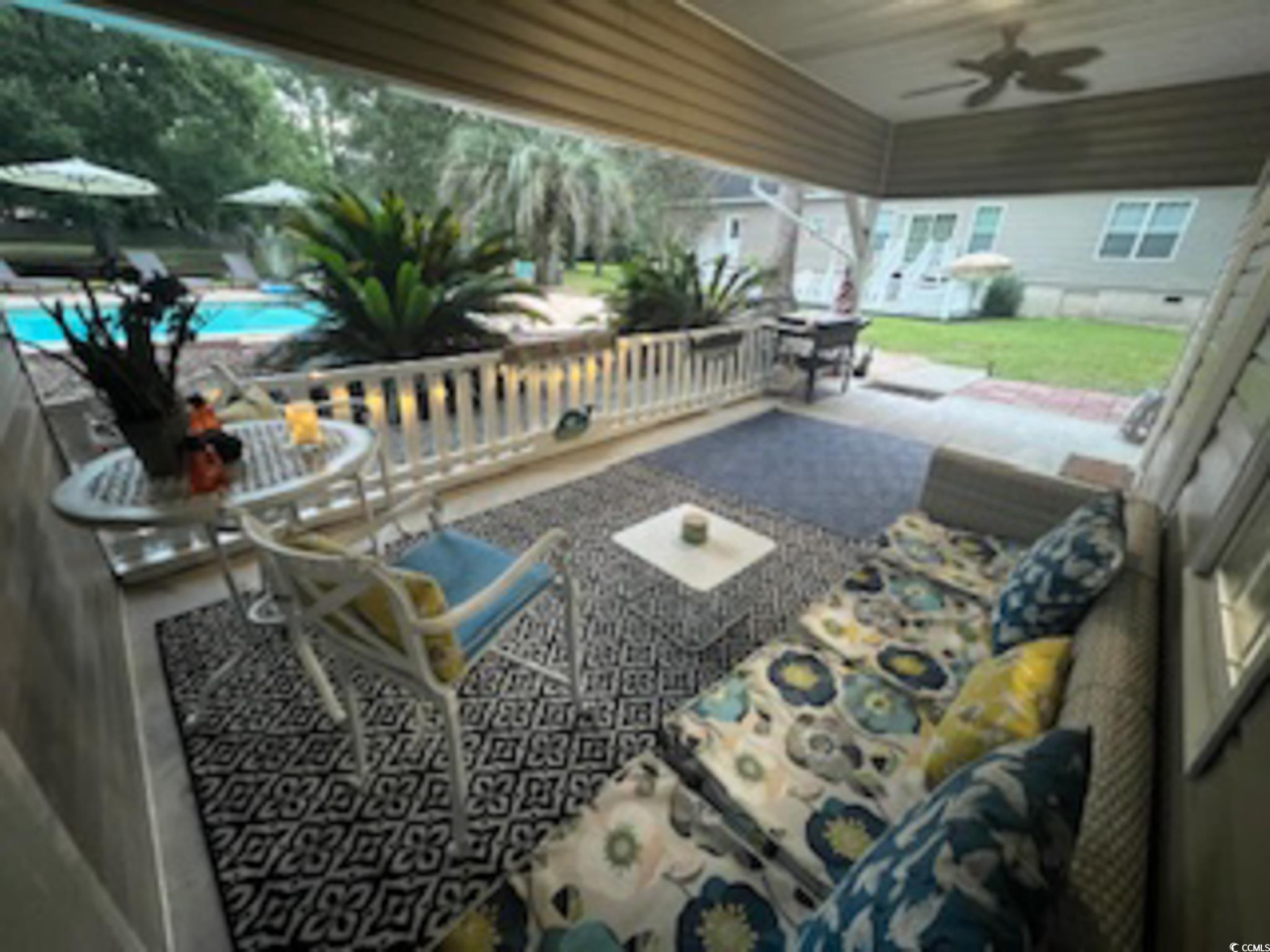 5588 Daybreak Road, Unit GUEST HOUSE Murrells Inlet, SC 29576 - Photo 2 of 18 View of patio / terrace with a ceiling fan