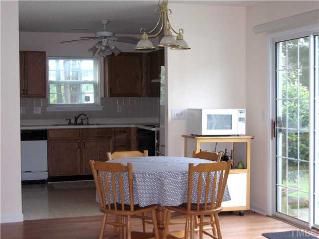4906 Gable Ridge Drive Durham, NC 27713 - Photo 3 of 24 Room for indoor dining. But it so easy to step out to the patio for a moment of relaxation, or a little grilling or perhaps even a drink before dinner. Dining Room