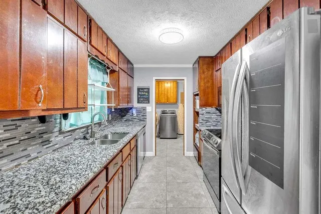 a kitchen with a stove and a microwave