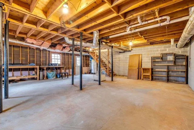 a view of a patio with two chairs next to a yard
