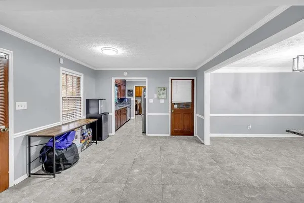 a view of empty room with furniture and fireplace