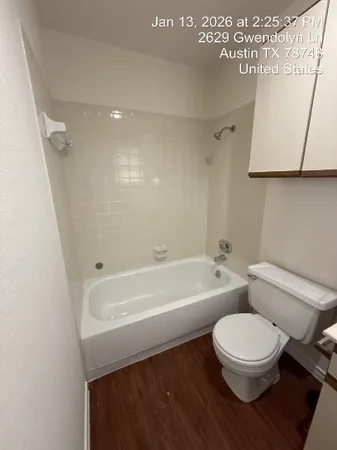 a bathroom with a toilet a sink and bathtub