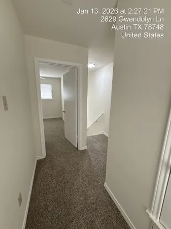 a garden with trees in front of it