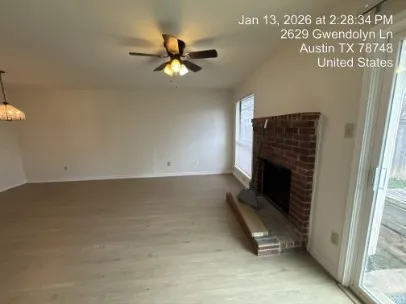 a living room with a fireplace furniture and a window