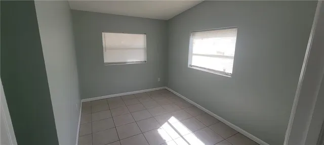 an empty room with windows