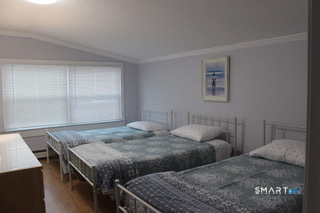 216 Broadway Milford, CT 06460 - Photo 13 of 18 a bedroom with two beds and a window