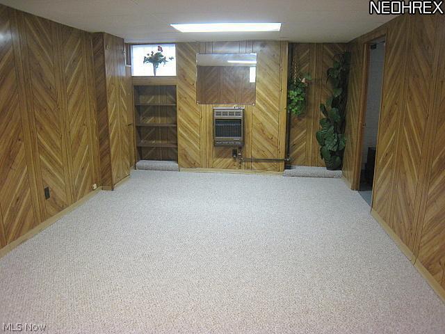 1051 Roanoke Road Cleveland, OH 44121 - Photo 22 of 25 Finished Recreation Room w/New Berber Carpet. Upgraded Panalized Walls. Built-In Bookcase. 1/2 Bath, Furnace(2008), Hot Water Tank(2008) Upgraded Electrical Breaker Box. Utility Tub and Plenty of Storage.
