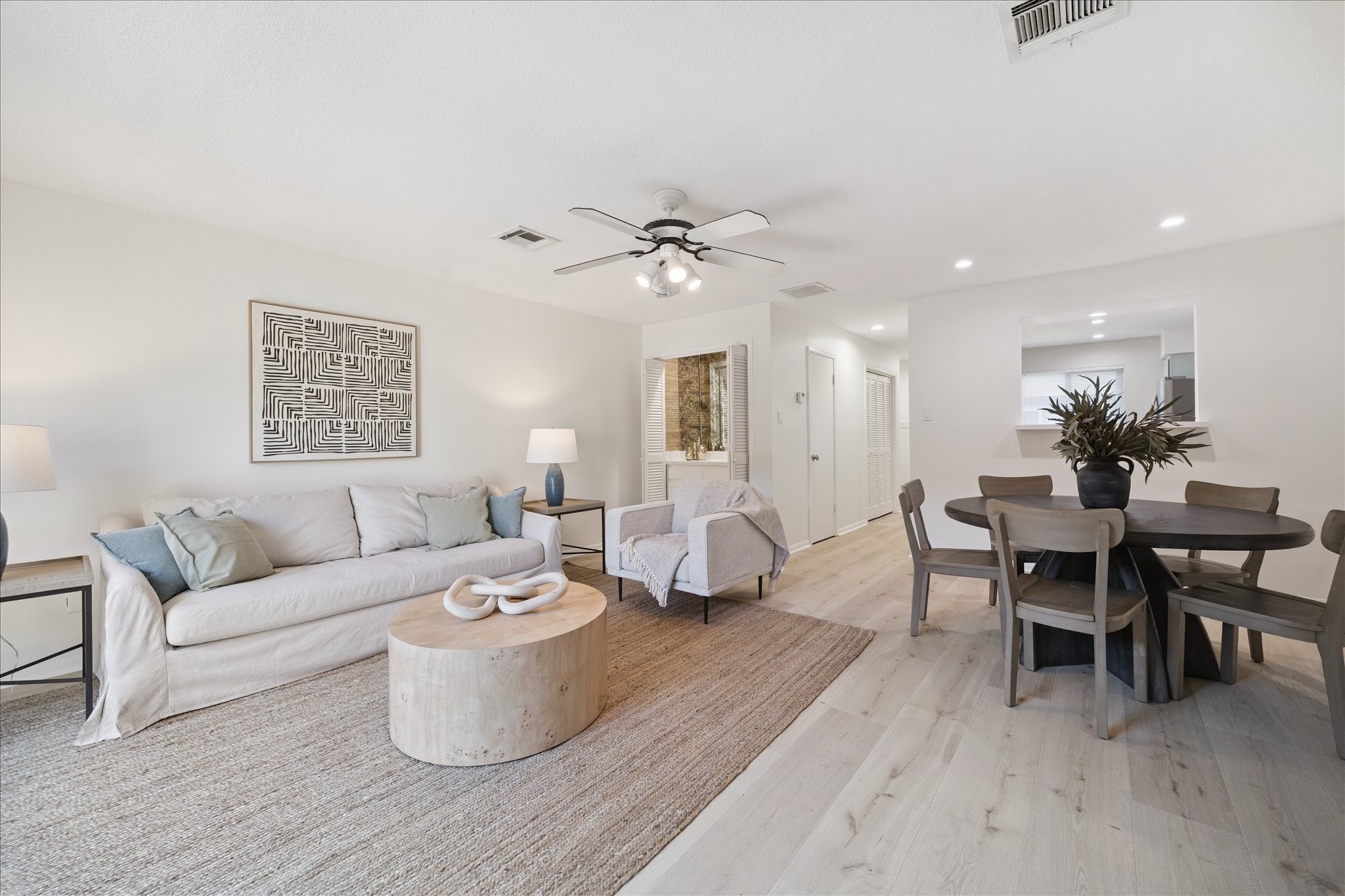 2515 Bering Drive, Unit 11 Houston, TX 77057 - Photo 1 of 26 a living room with furniture a window and a potted plant