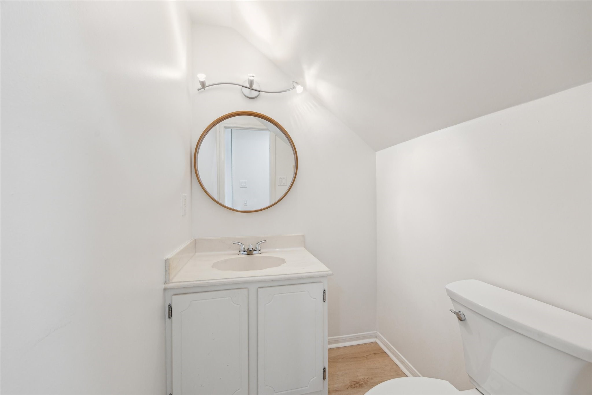 2515 Bering Drive, Unit 11 Houston, TX 77057 - Photo 11 of 26 a bathroom with a sink and a mirror