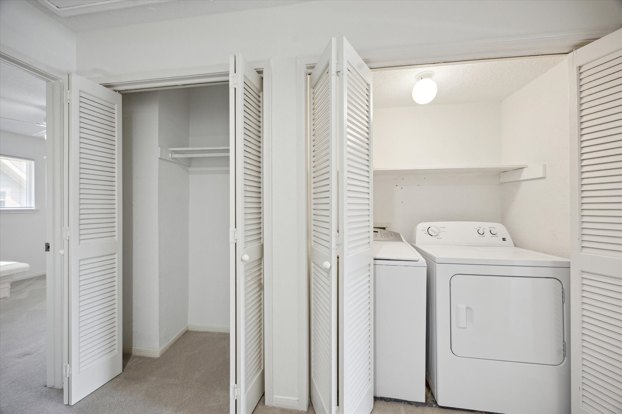 2515 Bering Drive, Unit 11 Houston, TX 77057 - Photo 21 of 26 a view of storage and utility room with washer and dryer