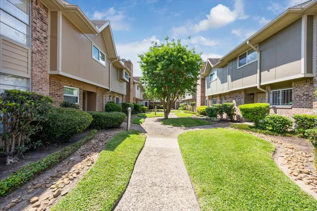 a view of a building with a yard