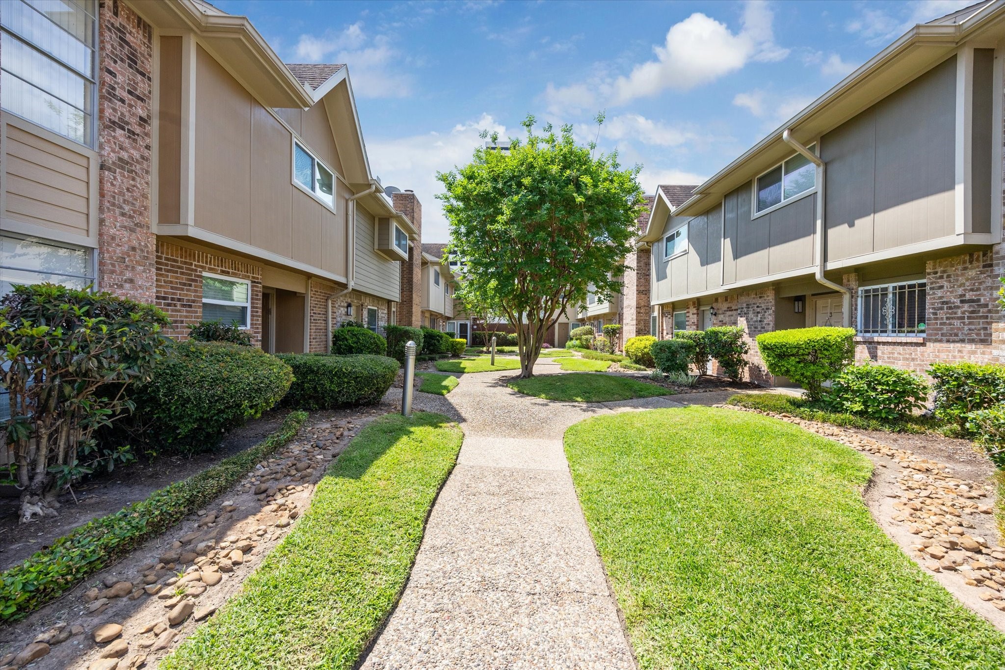 2515 Bering Drive, Unit 11 Houston, TX 77057 - Photo 26 of 26 a view of a building with a yard