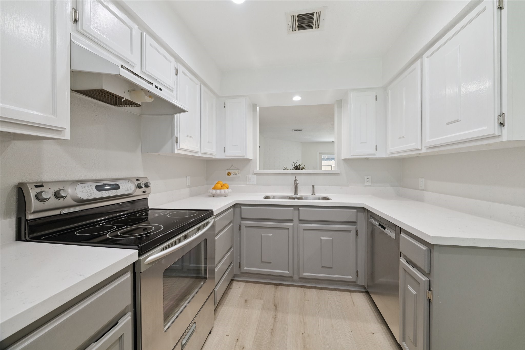2515 Bering Drive, Unit 11 Houston, TX 77057 - Photo 8 of 26 a kitchen with a sink stove and cabinets