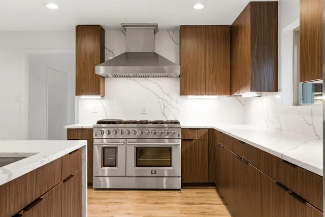 a kitchen with a stove and a sink