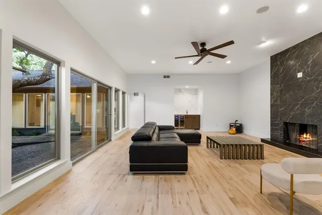 a bedroom with furniture and a fireplace