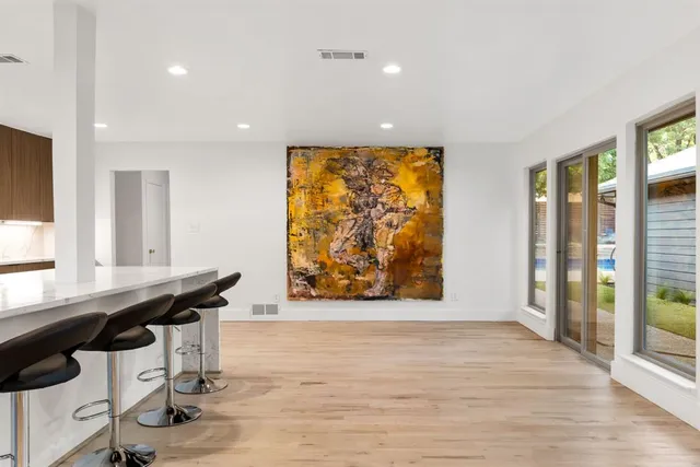 a view of a room with furniture and window