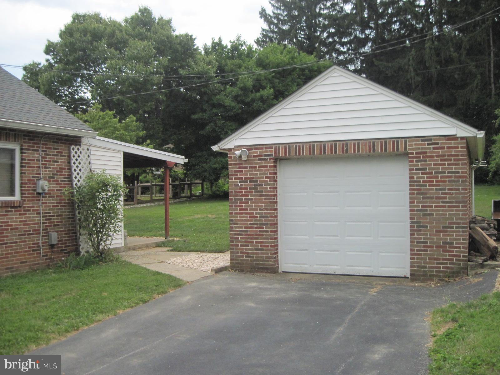 78 Homeland Road York, PA 17403 - Photo 54 of 70 a view of a house with a yard and garage