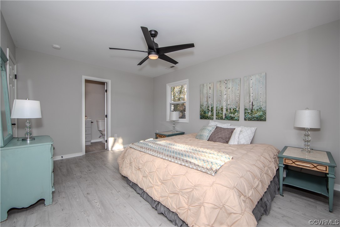 4629 Twelveoaks Road Midlothian, VA 23112 - Photo 11 of 23 a bedroom with a bed and a lamp