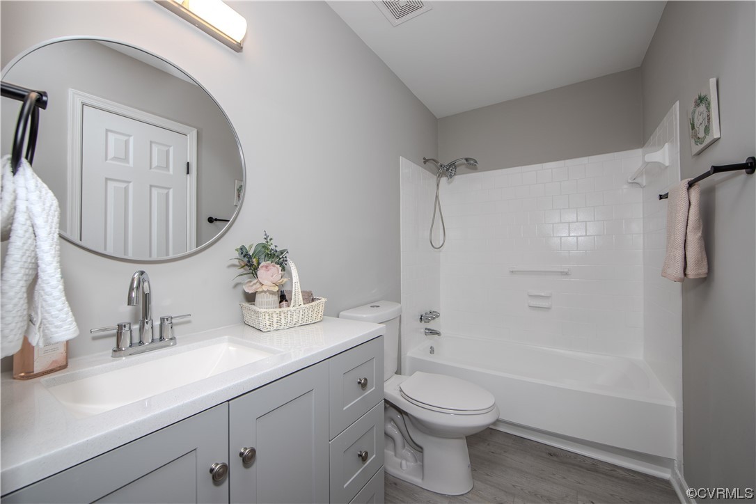 4629 Twelveoaks Road Midlothian, VA 23112 - Photo 12 of 23 a bathroom with a granite countertop sink a toilet and shower