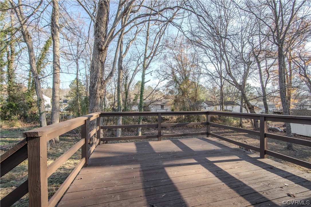 4629 Twelveoaks Road Midlothian, VA 23112 - Photo 18 of 23 a view of a balcony with wooden floor and fence