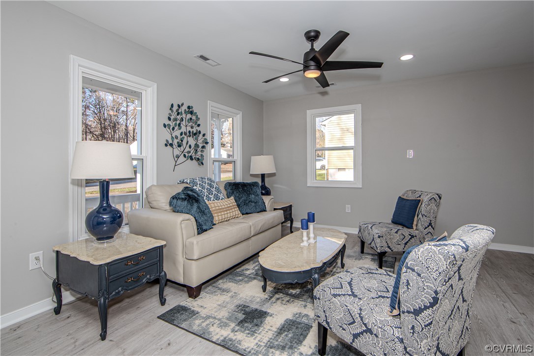 4629 Twelveoaks Road Midlothian, VA 23112 - Photo 2 of 23 a living room with furniture a lamp and a window