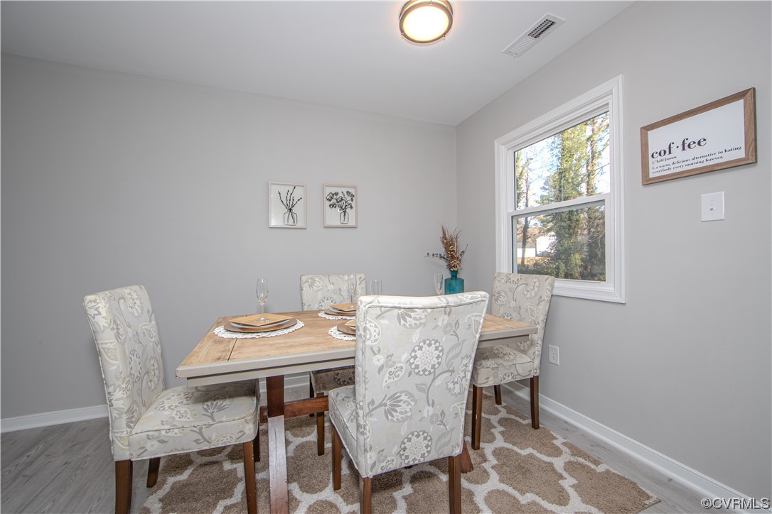 4629 Twelveoaks Road Midlothian, VA 23112 - Photo 6 of 23 a view of a dining room with furniture window and wooden floor