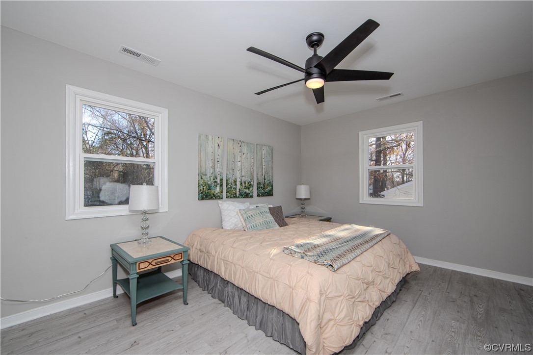4629 Twelveoaks Road Midlothian, VA 23112 - Photo 10 of 23 a bedroom with a bed and a painting on the wall