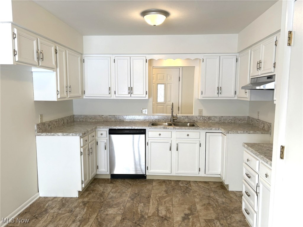 39535 Butternut Ridge Road Elyria, OH 44035 - Photo 15 of 35 Kitchen featuring white cabinetry, stainless steel dishwasher, and under cabinet range hood