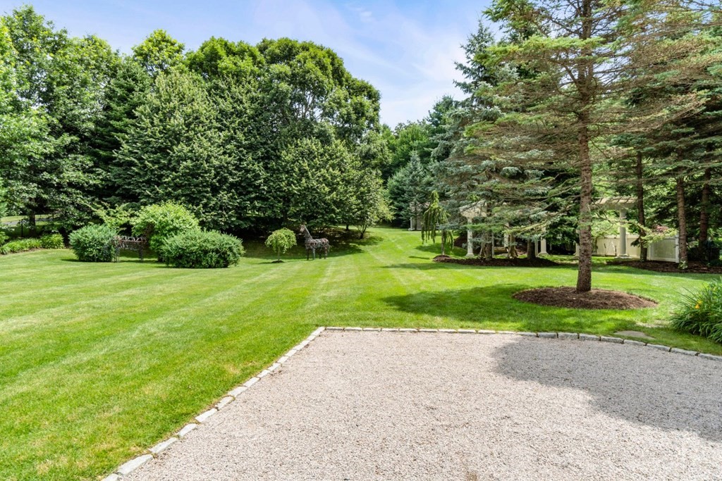 11 Stonegate Lane Westwood, MA 02090 - Photo 2 of 4 a view of a yard with plants