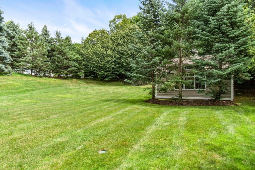 11 Stonegate Lane Westwood, MA 02090 - Photo 4 of 4 a front view of a house with a garden