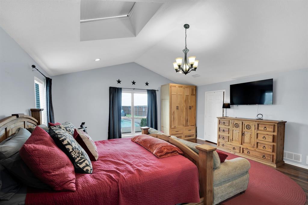 430 Carter Road Italy, TX 76651 - Photo 23 of 36 a bedroom with a bed and a flat screen tv