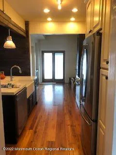 a kitchen with stainless steel appliances a refrigerator and a stove