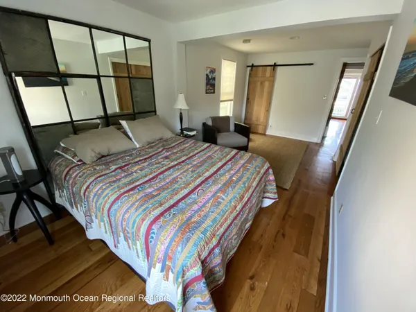 a bedroom with furniture and a window