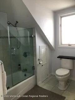 a kitchen with a sink a stove and cabinets