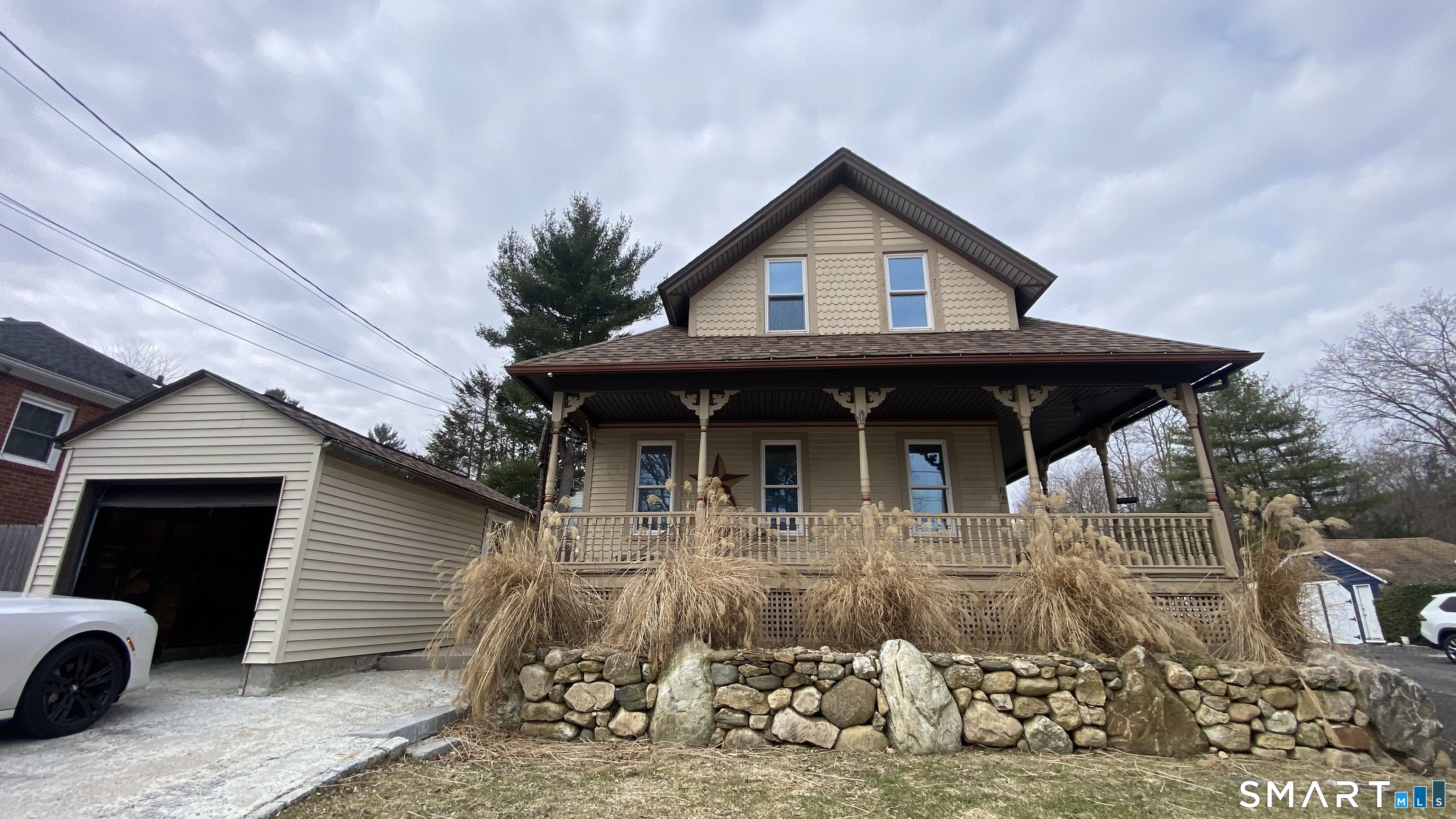 88 Belleview Avenue Torrington, CT 06790 - Photo 1 of 26 a view of house with wooden fence